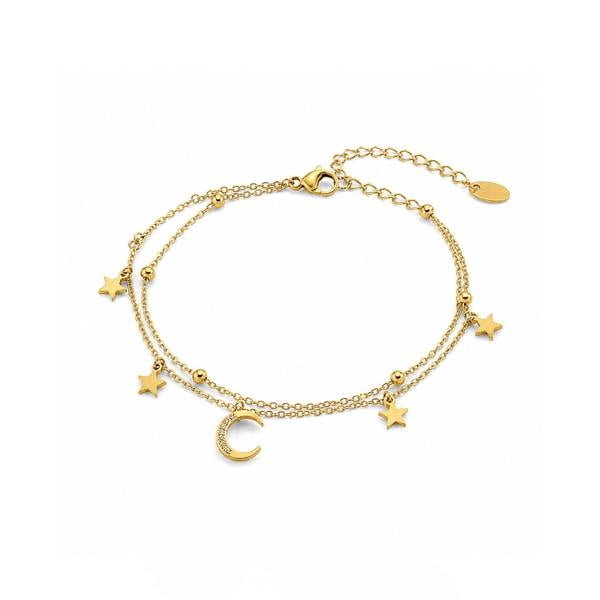 Gold bracelet with star and moon charms on a white background