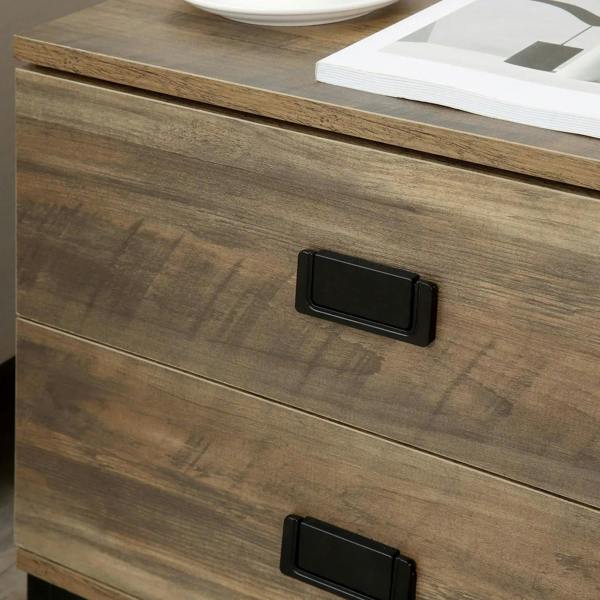 Brown retro bedside table close-up of two black drawer pulls on wood-grain front