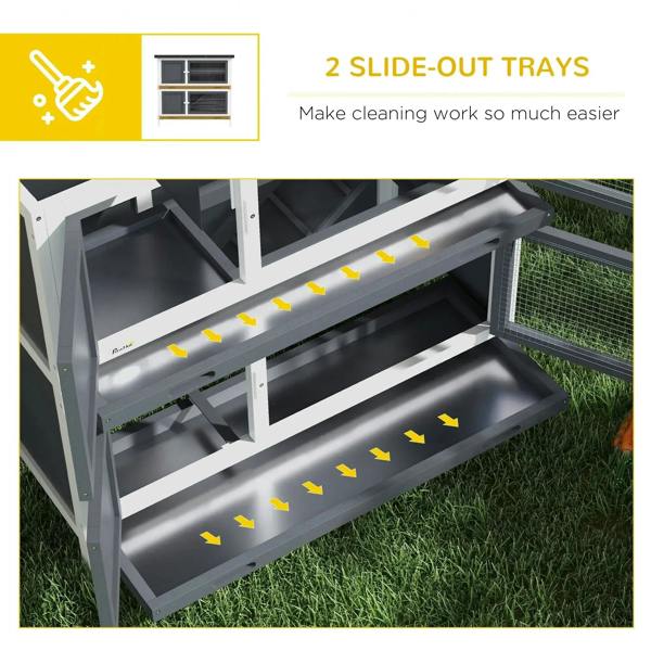 Two slide-out cleaning trays inside a grey two-tier rabbit hutch