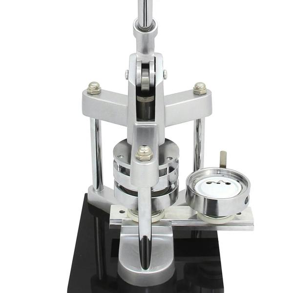 Heavy-duty badge maker with a sleek silver finish, featuring a sturdy base and a circular mold for crafting custom badges