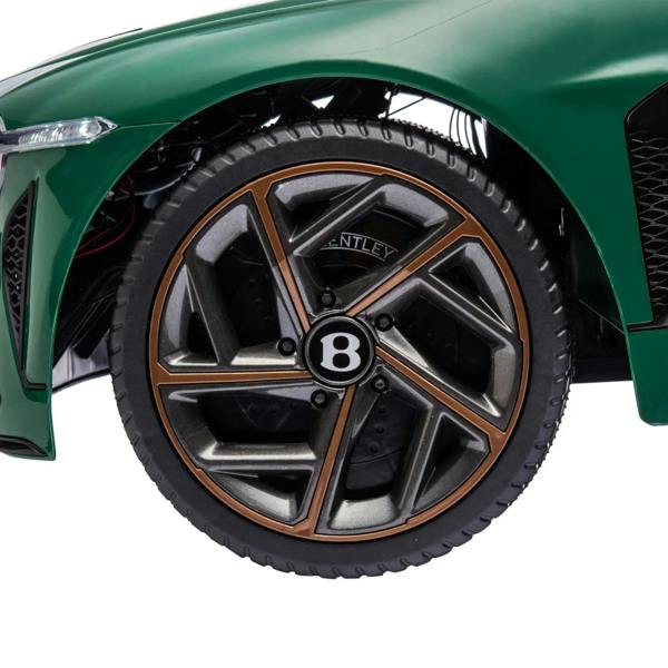 Green kids electric car wheel with alloy rim and black tire