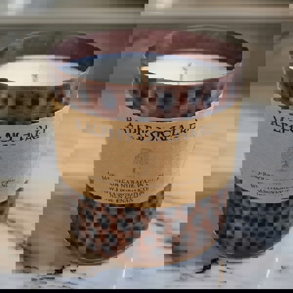 unscented candle in antique style tin