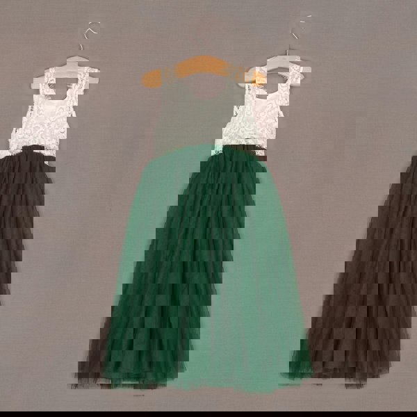 Baby Bohemian Classic Dress - Hunter Green on a hanger against a brown background