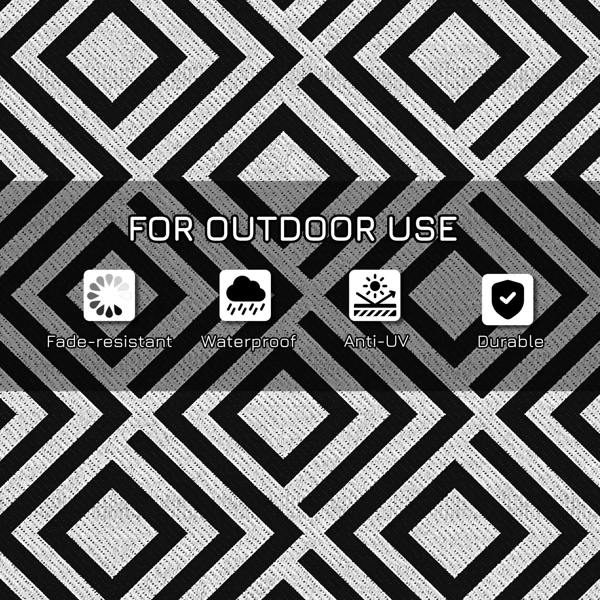 Black and white outdoor rug mat with textured diamond lattice pattern
