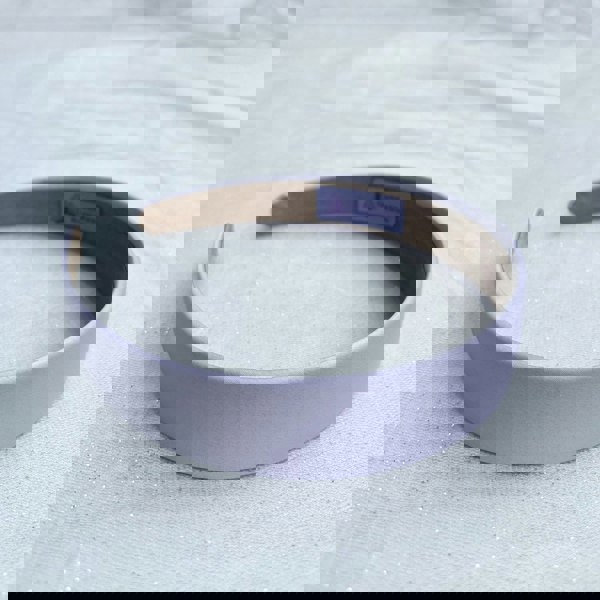 Lilac hairband, smooth satin finish, soft pastel purple shade, padded structure, minimalist elegant design, versatile everyday accessory
