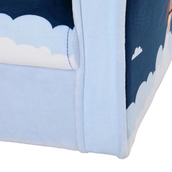 Close-up of kids' blue armchair corner with padded light-blue trim and stitched seam