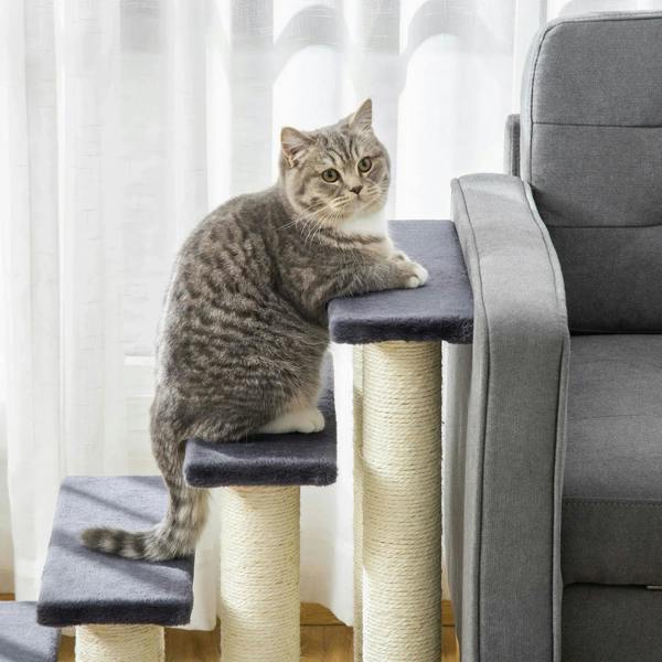 Grey 4-step pet stairs, cat sitting on front step beside sofa