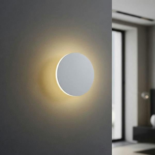 White LED internal wall light on a grey wall looking like a moon in a modern home