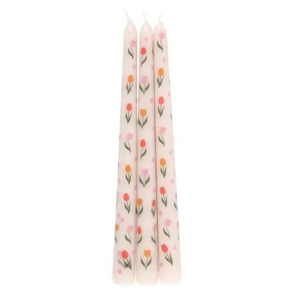Three tulip-print taper candles, pale pink and white with orange and pink tulips