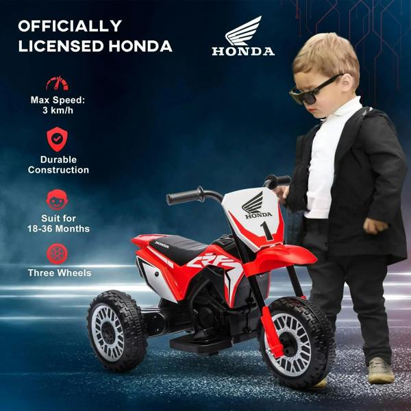Red three-wheel kids electric motorbike with black seat; child standing and holding handlebar
