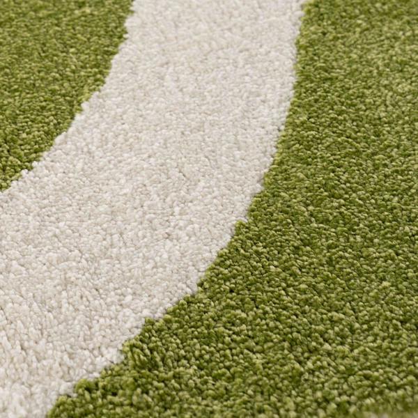 Close-up of green and beige carpet texture