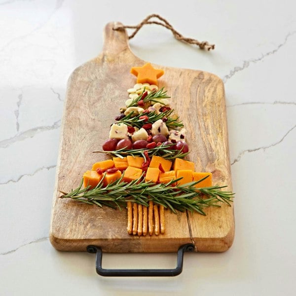 A christmas tree made of cheese and crackers on a Personalised Natural Mango Wood Rectangular Chopping Board.