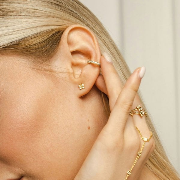 BLOOMTINE Enchanting Flutterfly™ Butterfly Studs in 925 Sterling Silver. These 5mm dainty earrings feature 8 brilliant-cut lab moissanites, symbolizing transformation and resilience. Handcrafted for the extraordinary human and available at Wolf & Badger