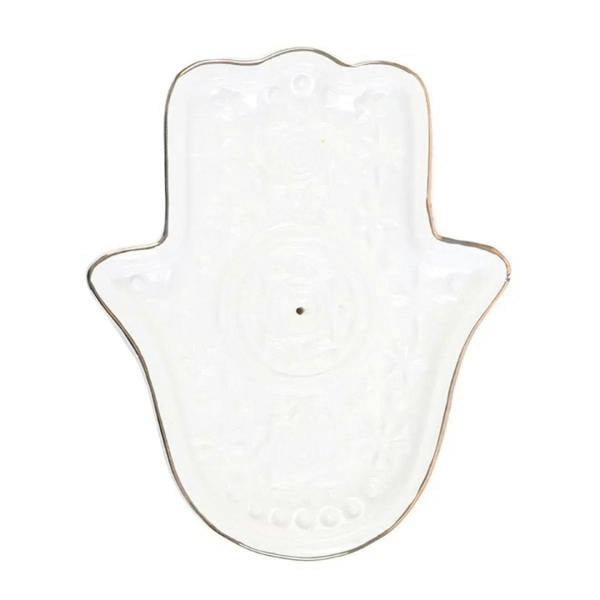 White hamsa hand incense holder and trinket dish with embossed eye and floral motifs