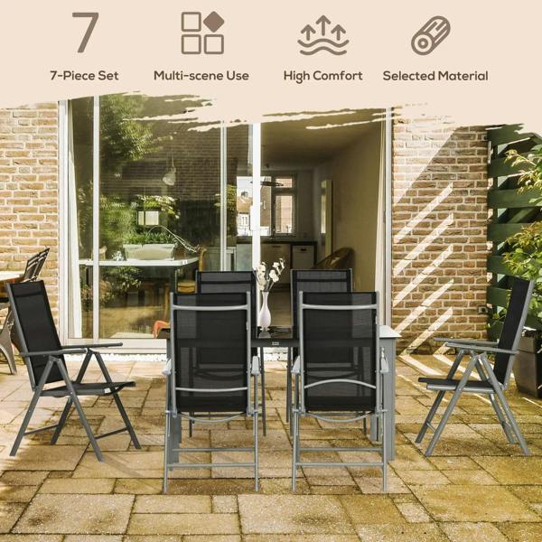 Outdoor dining set with six black reclining chairs and rectangular glass-top table on patio