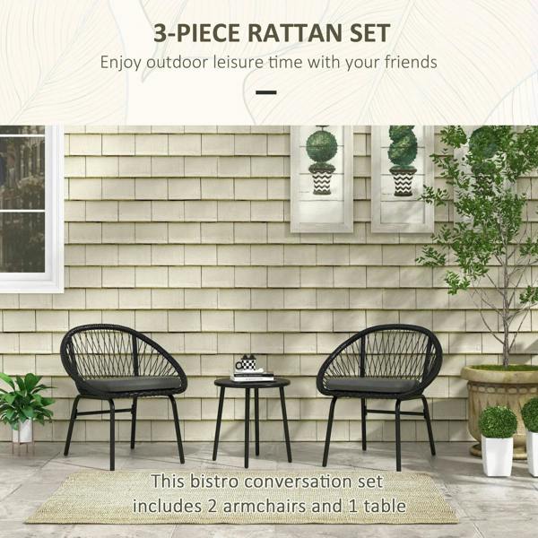 Black rattan bistro set with two armchairs and round table, cushioned seats