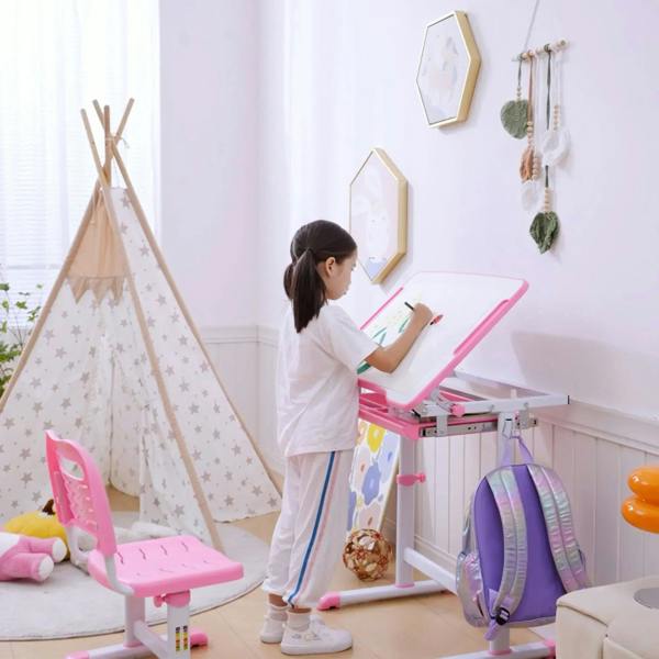 Pink kids desk and chair set with tilted tabletop for writing and drawer storage