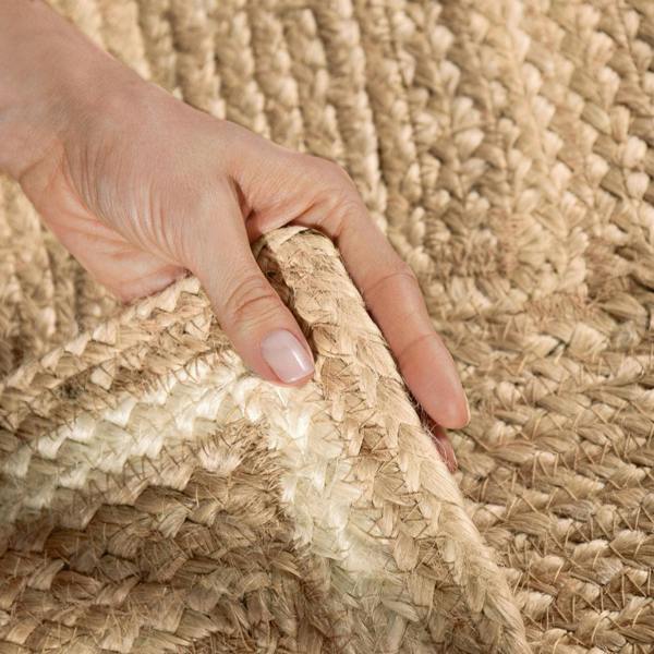 Hand touching a textured woven surface