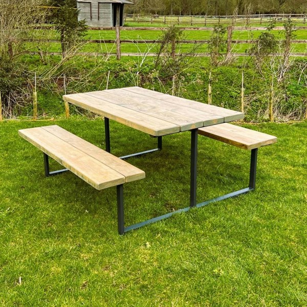 Bespoke outdoor reclaimed picnic table & bench set on the grass.