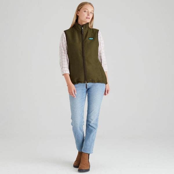 Woman modelling Ridgeline Womens Monarch gilet in moody teak styled for shooters and farmers