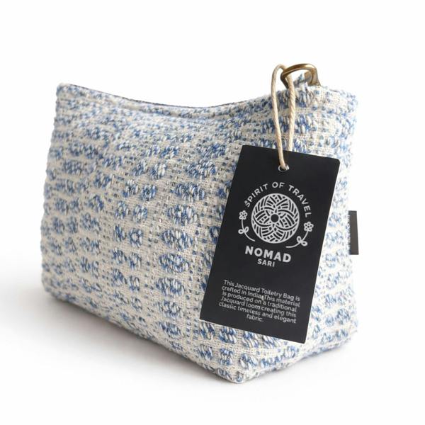 Indigo jacquard toiletry bag with hang tag and zip-top closure