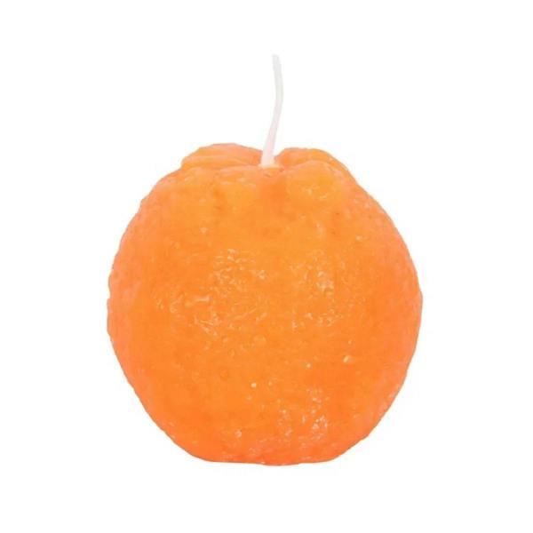 Orange shaped candle with white wick, close-up.