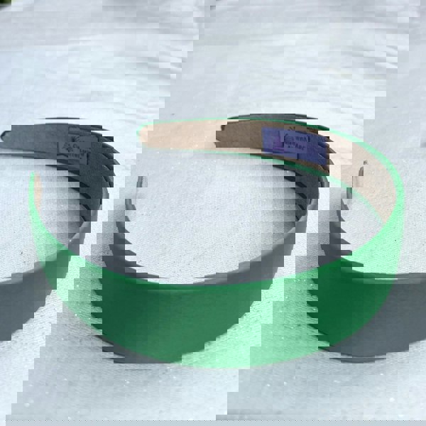 Green hairband, smooth satin finish, slim padded design, bold green colour, classic everyday accessory, simple minimalist headband
