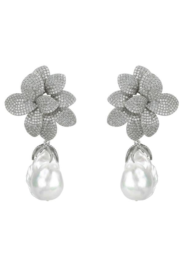 Pair of floral earrings with pearl drops on a white background