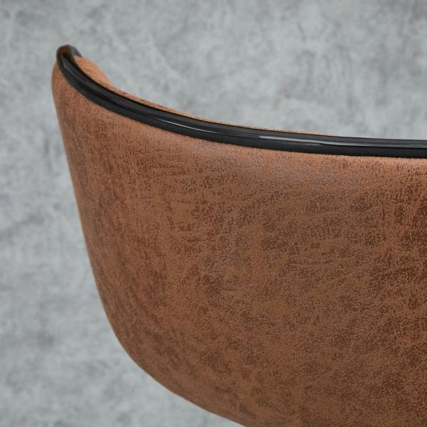 Close-up of brown microfiber bar stool back with black trim around the edge