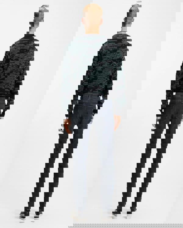 Model wearing BOSS Orange ReMaine Mens Jeans 50555289 in Dark Blue 408 - Back