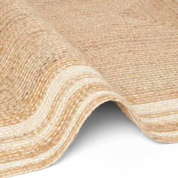 Close-up of beige textured fabric with a slight sheen on a white background