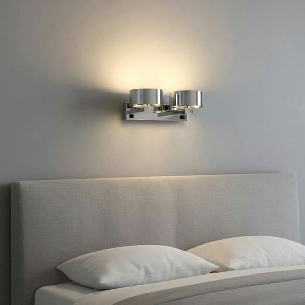 Polished chrome over bed reading light installed over a bed in a clean modern bedroom