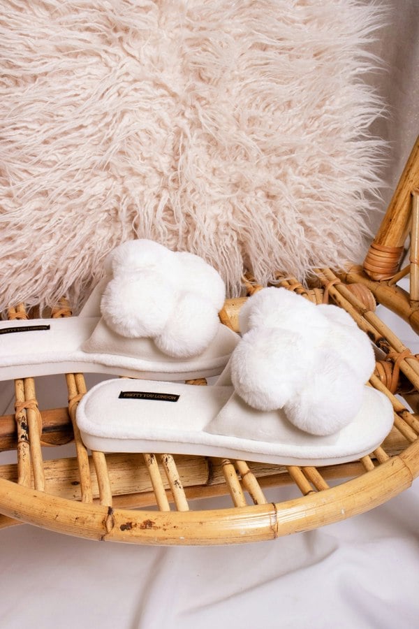 Dolly women's slider slippers in white with oversized faux fur pom poms from Pretty You London