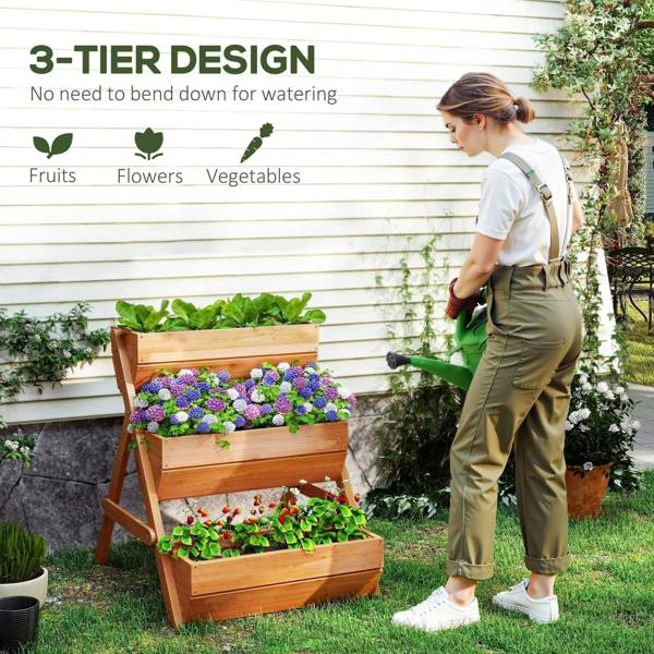 Brown 3-tier raised wooden planter box with flowers, next to a standing gardener