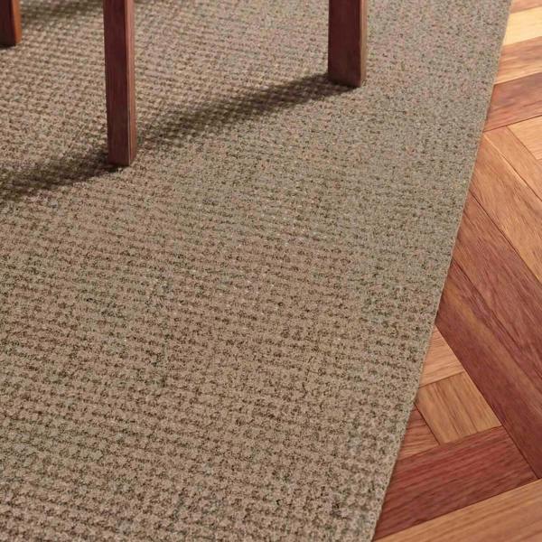 Brown carpet transitioning to wooden flooring
