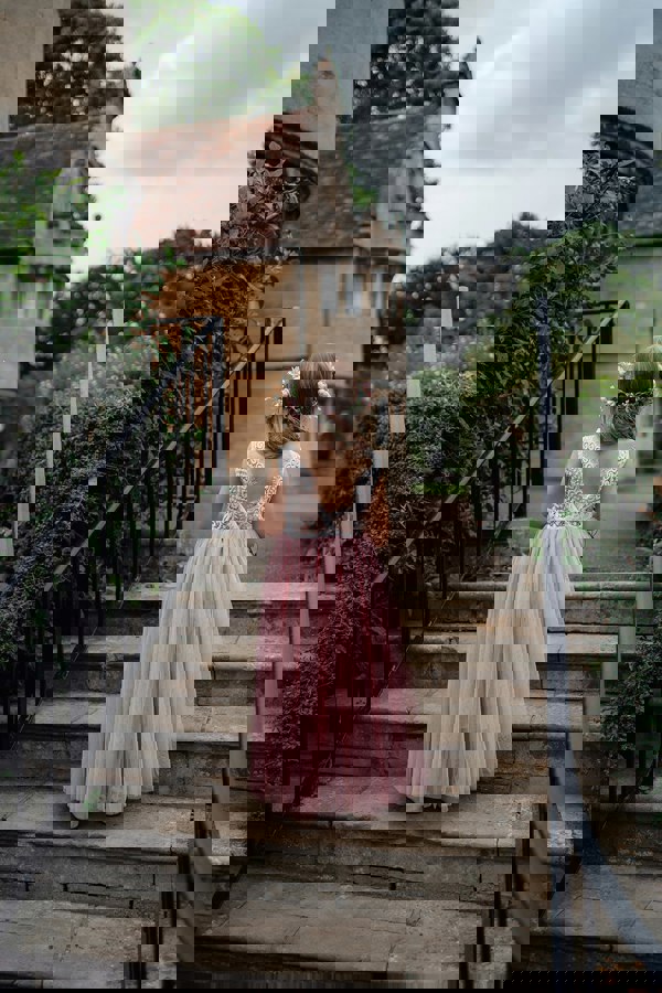 young flower girl walking away