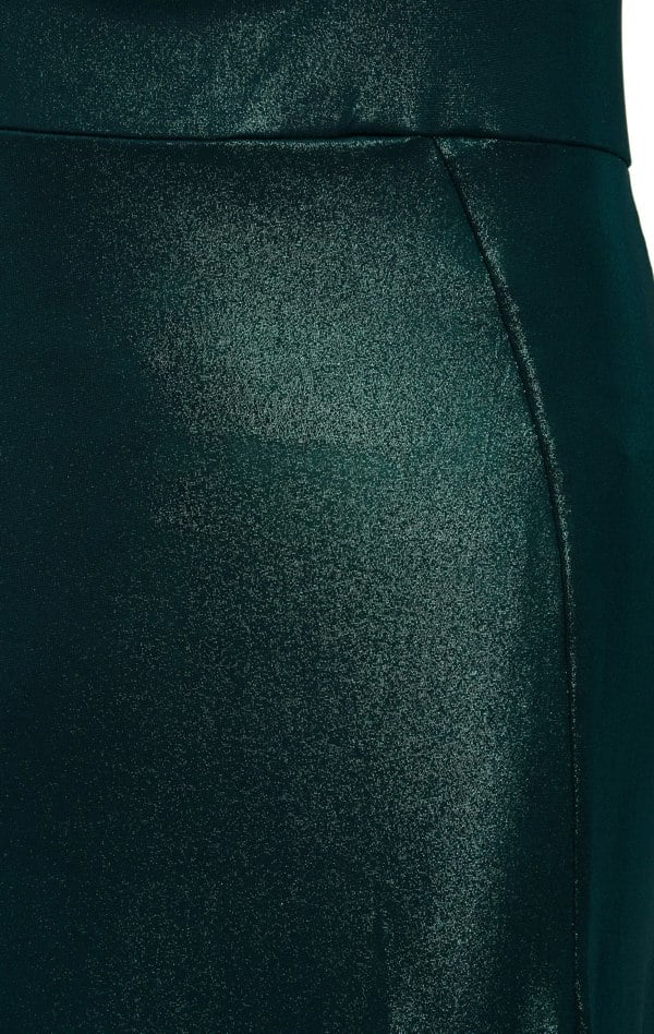 A close up of a woman's Sarvin Green Cut Out Side Dress.