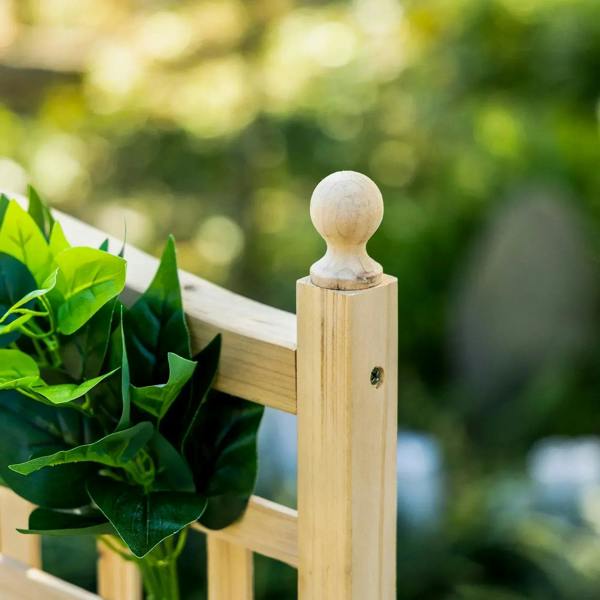 Wood trellis post with round finial on top and connecting rail