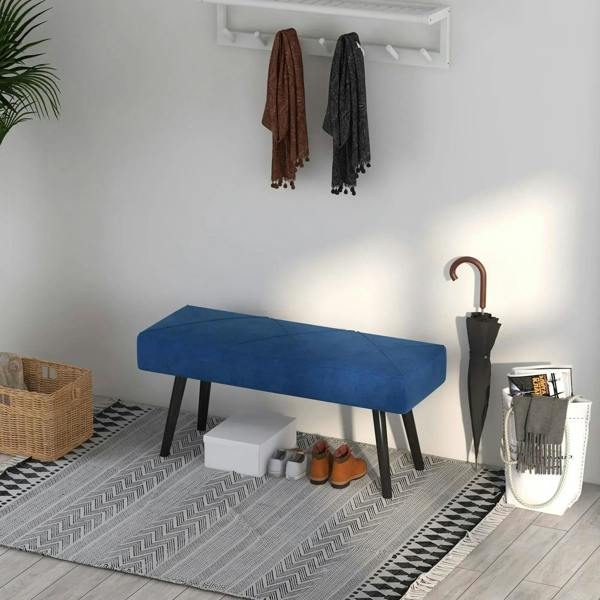 Blue upholstered end-of-bed bench with black legs in a hallway setting