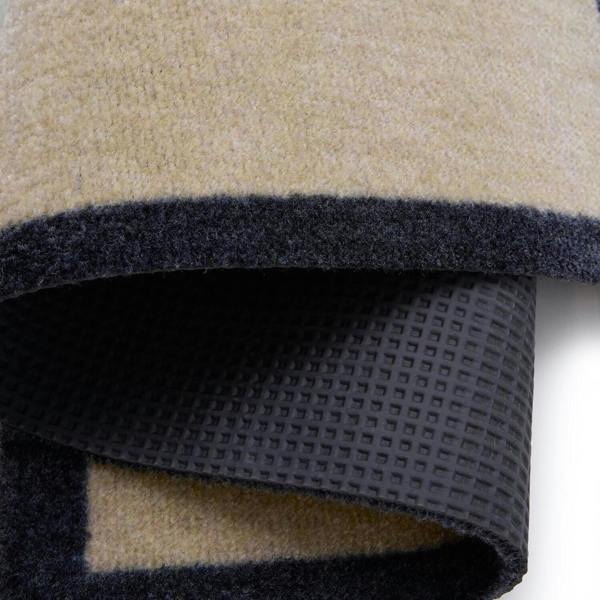 Close-up of a folded fabric with beige, black, and gray colors.