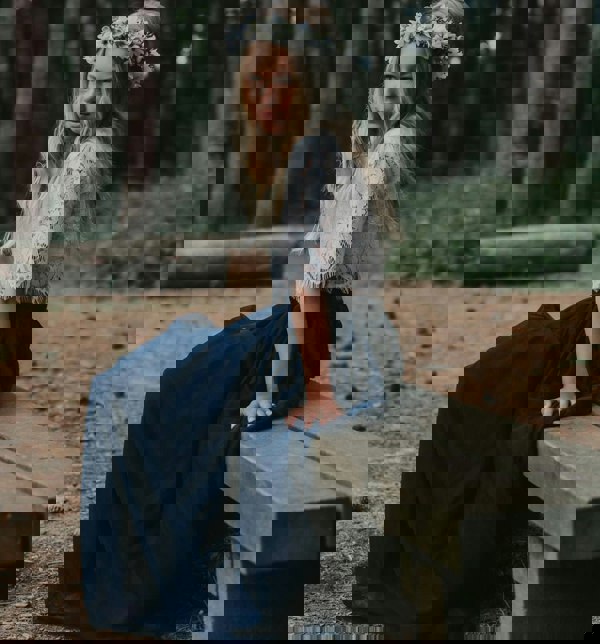 young girl sitting on bench