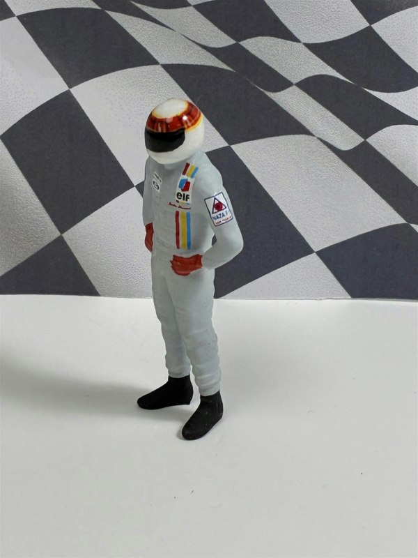 a toy figure of a man wearing a helmet