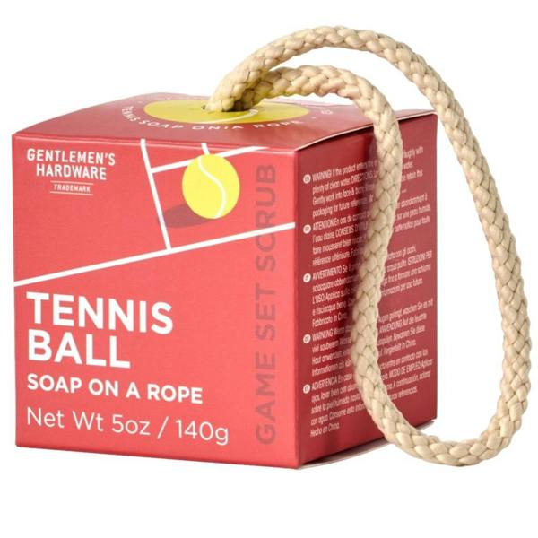 The red "Game Set Scrub" themed gift box packaging for the Gentlemen's Hardware Tennis Ball Soap on a Rope, with the woven cord looping out from the top.