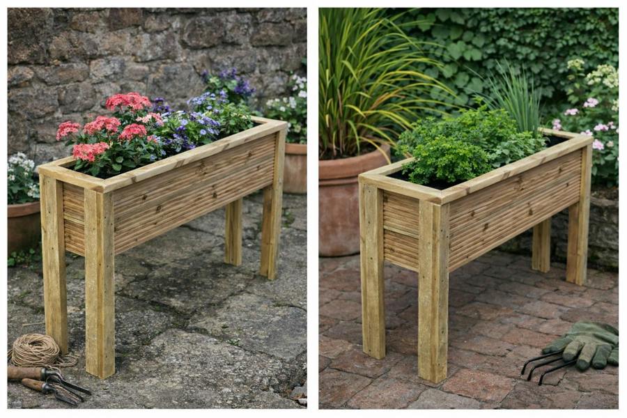 Raised wooden decking planter in garden setting with herbs and flowers planted inside