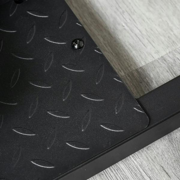 Black textured base pad with raised tread dots and mounting knob