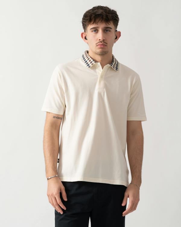 studio shot of model wearing an Aquascutum Mens Club Check Collar Polo Shirt in Old White 02