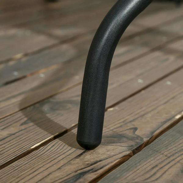 Close-up of black table leg base on tempered glass square outdoor dining table