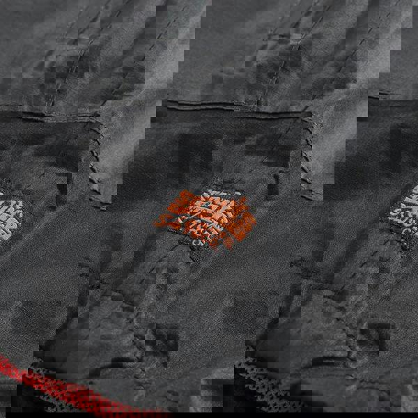 Scruffs Tech Mens Zip Up Work Warm Hooded Jacket Coat, close-up image showing the black fabric and orange Scruffs logo tag.