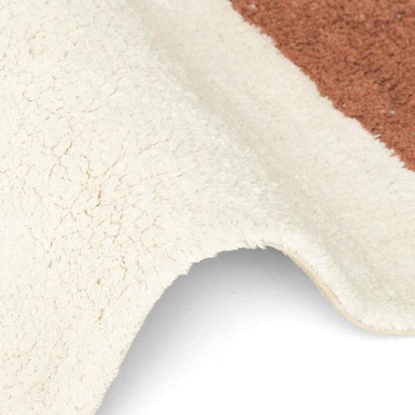 Close-up of a textured surface with beige, brown, and gray colors.