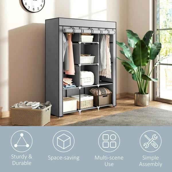 Light grey fabric wardrobe with hanging rail and shelves, styled with folded linens and drawers.